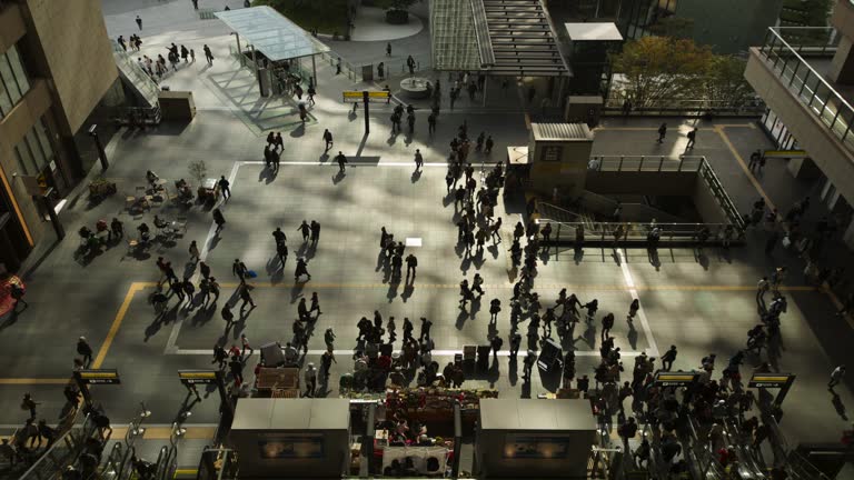 ZoomOut 4k timelapse video. A bird's-eye view of a department store in Japan during a busy morning. and rushing to work