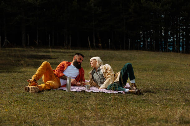 istock Cheerful couple having a small picnic. 1995147982