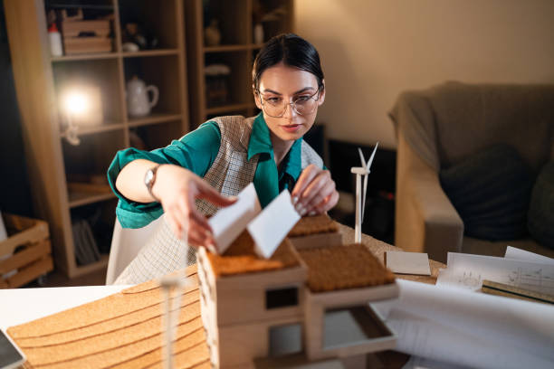 istock Young female architect making an architectural model in her home office 1995150230