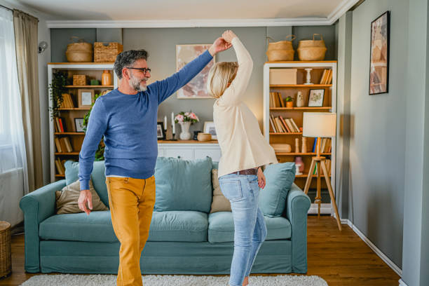istock Mature couple dancing at home 1995152490