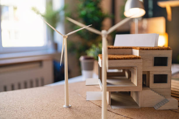 istock Architectural model of a modern house with wind turbines 1995152922