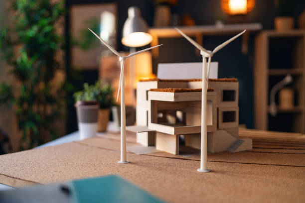 istock Architectural model of a modern house with wind turbines 1995153972