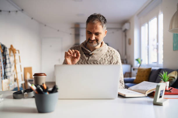 istock Mature Caucasian man working at his home office 1995155663