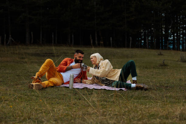 istock Couple on picnic in nature. 1995155664