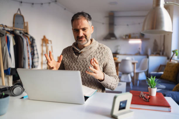 istock Mature Caucasian man having a video call from his home office 1995155682