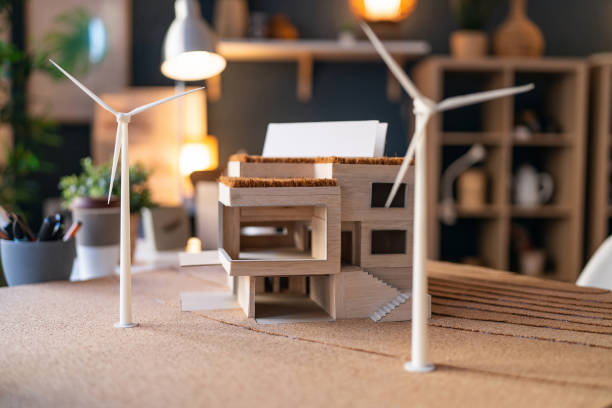 istock Architectural model of a modern house with wind turbines 1995158429