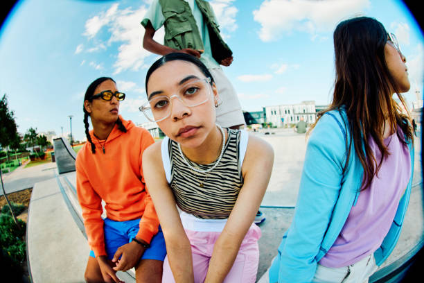 istock Serious looking Generation Z Teens Hanging out at the Skate Park 1995160624