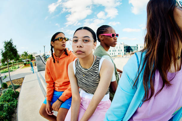 istock Serious looking Generation Z Teens Hanging out at the Skate Park 1995160631