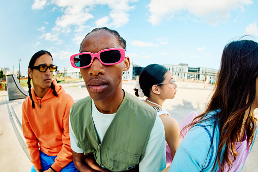 Serious looking Generation Z Teens Hanging out at the Skate Park