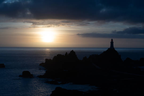 Sunset at Osezaki Lighthouse on Fukue Island, Goto Islands, Nagasaki Prefecture, Japan – tranquil seascape with orange sky, ocean cliffs, and coastal horizon.