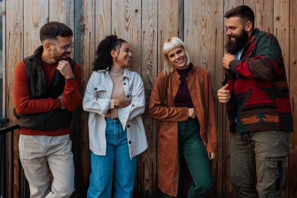 istock Friends hanging out on mountain cabin patio. 1995163868