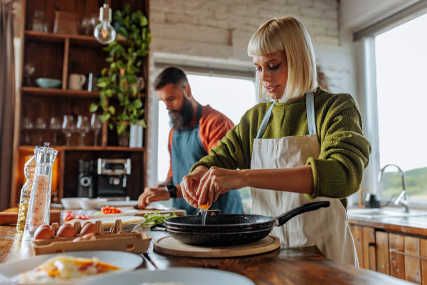 istock Young couple cooking at home. 1995166009