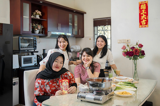 multi racial friend having Chinese New Year eve reunion dinner at home