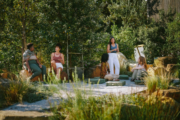 istock Diverse women talking while sitting outside at a scenic wellness retreat 1995171450