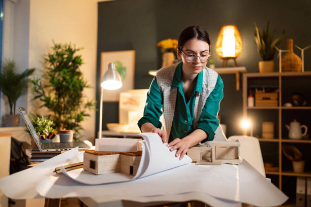 istock Young female architect working in her home office 1995175436