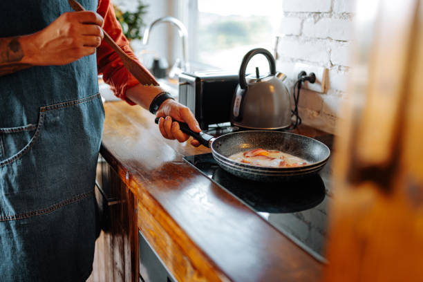istock Close up of man cooking. 1995176581