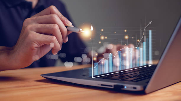 istock businessman or trader analyzing forex trading graph financial data, investor, cryptocurrency, Stock Market Investments Funds and Digital Assets, busines concept 1995177115