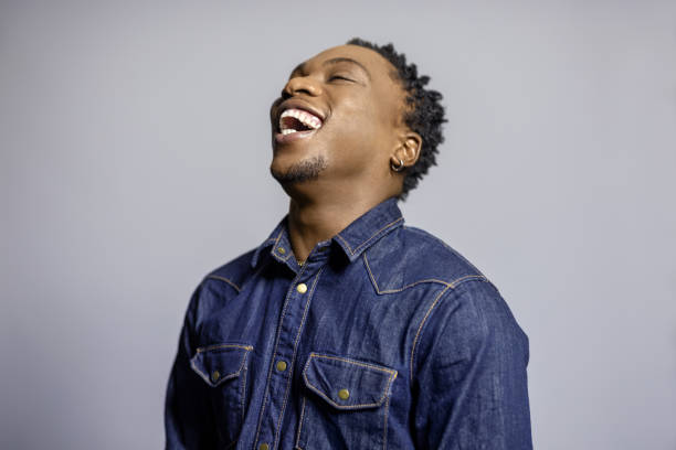 istock Cheerful young african man against gray background 1995178169