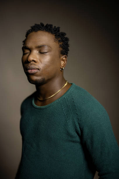 istock Young African man with his eyes closed in studio 1995178172