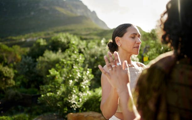 istock Diverse women doing a wellness exercise outdoors during a retreat 1995181441