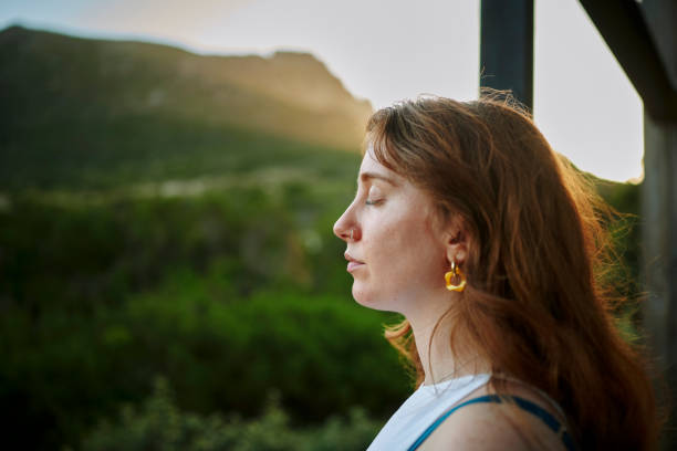 istock Young woman relaxing on a spa balcony with a scenic view 1995183590