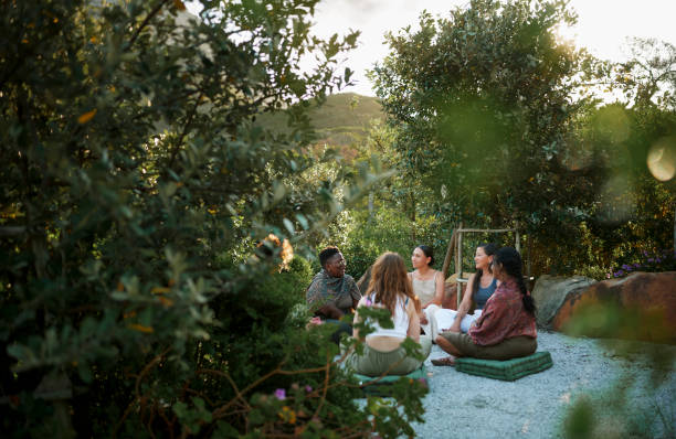 istock Diverse women talking in a circle outdoors during a wellness retreat 1995184118