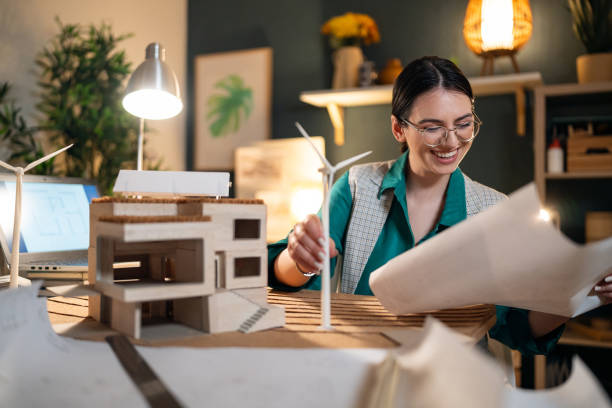 istock Young female architect working in her home office 1995187310