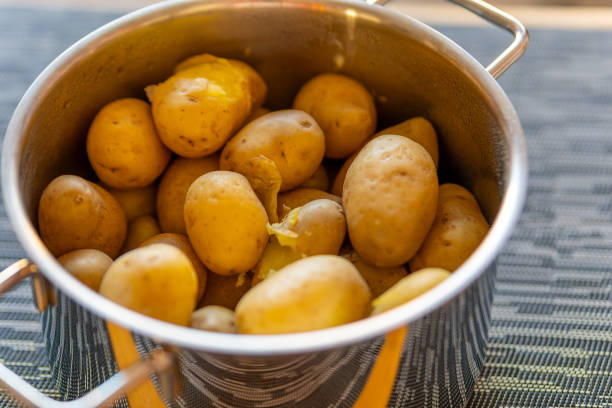 istock a cooking pot with unpeeled cooked potatoes 1995192152