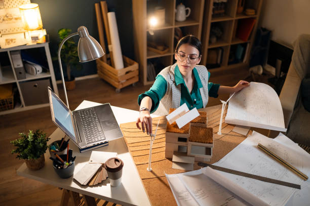 istock Young female architect making an architectural model in her home office 1995193209