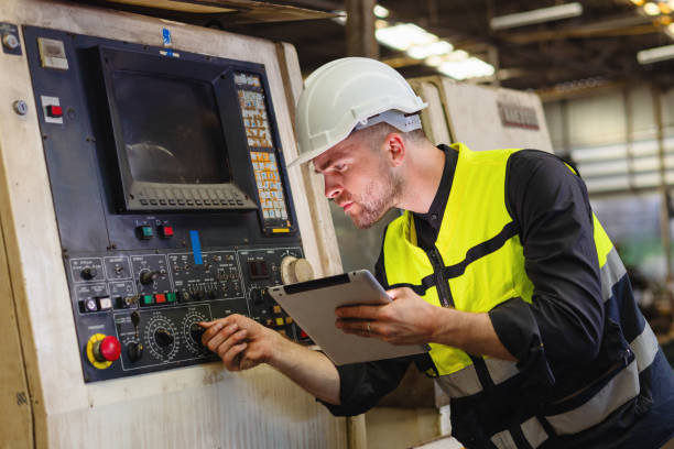 istock engineer look projects and planning with tablet mobile in factory 1995194351