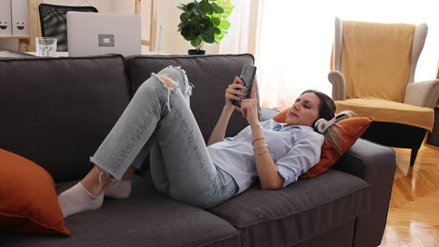 Chill Vibes: Young Woman Enjoying Movies and Music in HD