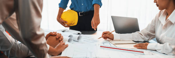 istock Engineer partner drawing and working on blueprint design together. Insight 1995213171