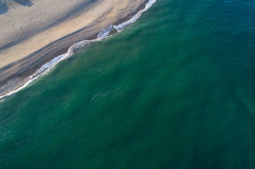 drone aerial view of a beach at dawn