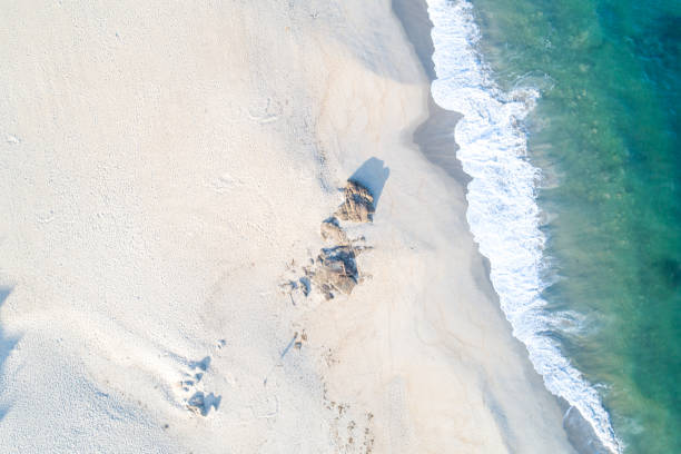 istock drone aerial top view of a beach at dawn 1995227595