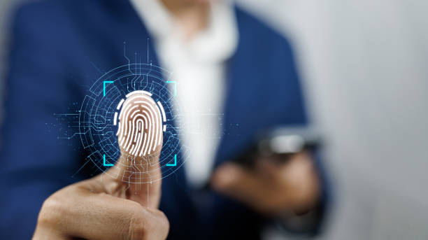istock Businessman using fingerprint indentification for financial security Cybernetics and security. Fingerprint scanning and biometric authentication in business E-KYC innovation, Personal data privacy. 1995232954