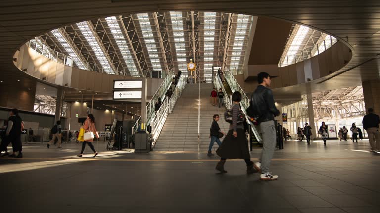 ZoomOut 4k timelapse video. view of a department store in Japan during a busy morning. and rushing to work