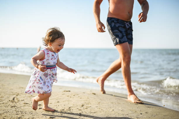 istock Candid family on a beach. 1995253966
