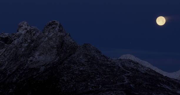 istock Lunar Majesty Over Lofoten Peaks: Nighttime in Norway's Arctic Wilderness 1995254480