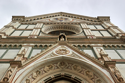 Architectural fragments of Florence Basilica of Holy Cross (Basilica di Santa Croce, 1385) - Franciscan church on Piazza di Santa Croce - largest Franciscan church in world. Florence, Tuscany, Italy.