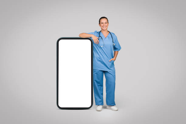 istock Smiling woman nurse leaning on giant phone, tech-savvy 1995277551