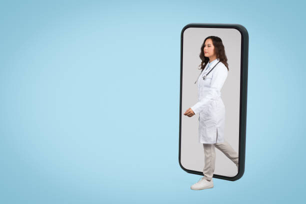 istock Doctor stepping out from smartphone frame 1995278952