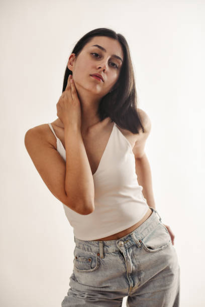 istock Passionate Female Rubbing Neck While Wearing Casual Clothing 1995287967