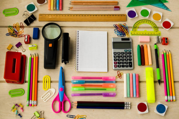 istock Various school or stationery items designed on wooden surface 1995291185