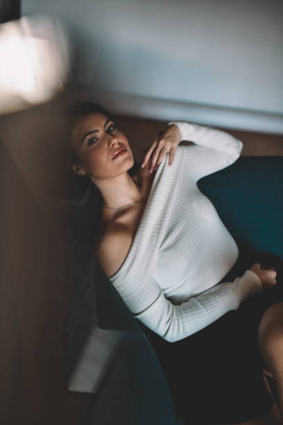 istock Beautiful Female With Piercing Gaze Relaxing At Home 1995321533