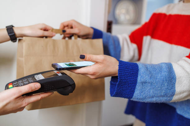 istock NFC contactless payment by mobile phone and pos terminal 1995352028
