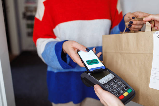 istock NFC contactless payment by mobile phone and pos terminal 1995352048