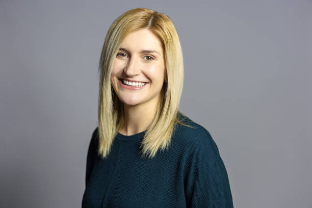 istock Cheerful young woman looking at camera in studio 1995362605