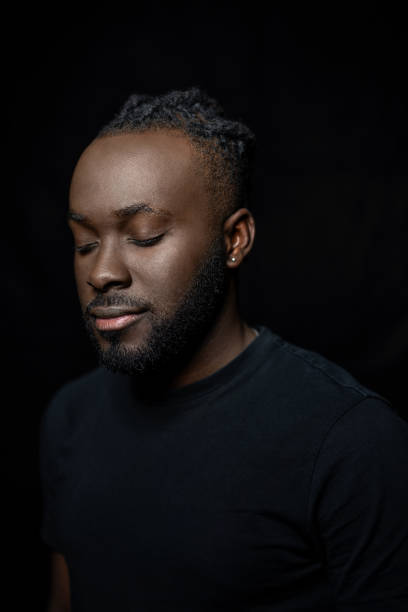 istock Young African man thinking with his eyes closed 1995368339
