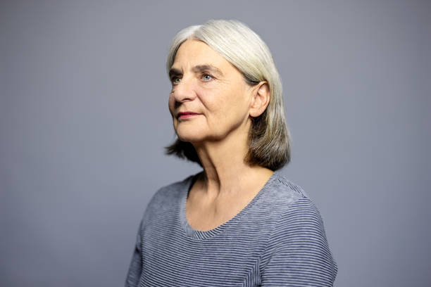 istock Senior woman in casuals looking away in studio 1995368348