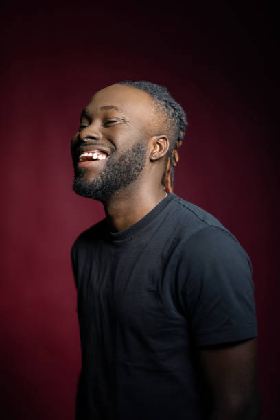 istock Cheerful African man in casuals looking away in studio 1995390670